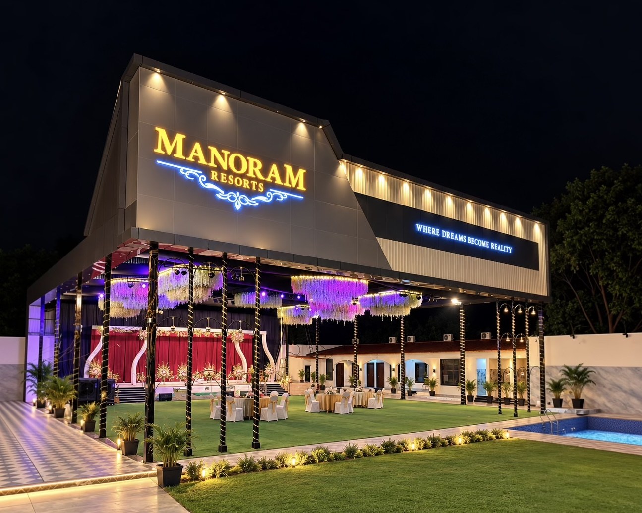Manoram Resorts open-air lawn set for a celebration, with round tables beneath a lit canopy